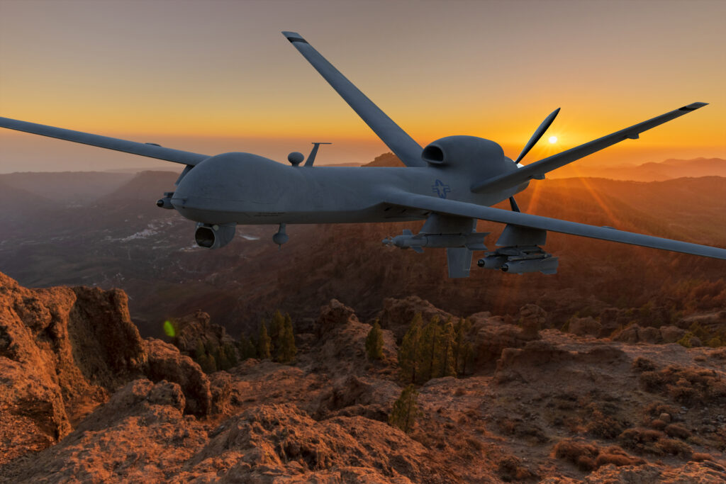 General Atomics MQ-9 Reaper drone flying over the mountains at s